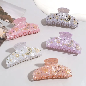 Star and moon marble patterned hair claws with rhinestones in five assorted colors