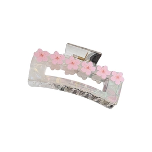 Pearlescent acetic acid hair claw with pink cherry blossom details and metal spring