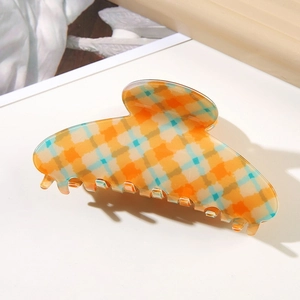 Classic orange checkered hair claw clip with cross-teeth design for women hair styling
