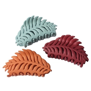 Set of three matte leaf-shaped hair claws in green, burgundy, and orange for women