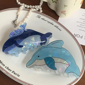 Cute dolphin hair claws in blue and light blue with a pearlescent finish for women