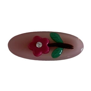 Oval rhinestone flower hair clip in jelly pink with green leaves and a sparkling center