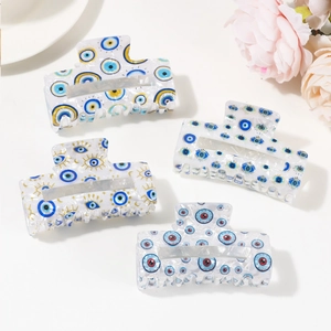 Chic PVC hair claw clip set with evil eye patterns on elegant white background
