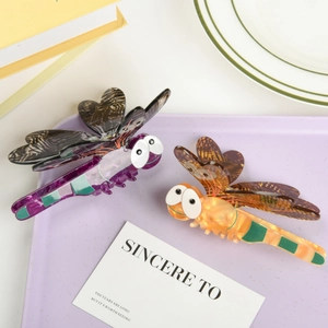 Chic acetate dragonfly hair claw clips in purple and orange with detailed wing texture