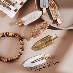 Fermi per capelli minimalisti in acetato marmorizzato e tartarugato con base a coccodrillo