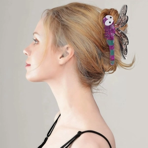 Detail view of the purple acetate dragonfly hair claw clip with black and white wing patterns