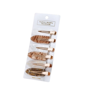 Set di 6 fermagli per capelli in acetato con motivi marmorizzati su scheda bianca