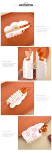 Detailed views showing the spring mechanism and acetate sheep pattern of the shark hair clip