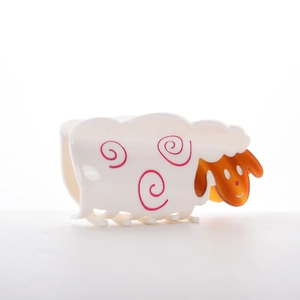 Cute cartoon sheep hair claw clip in white acetate with amber accents and spiral pattern
