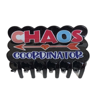 Sparkly black acrylic hair claw clip with Chaos Coordinator text and heart arrow design