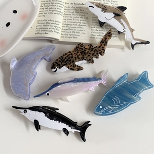 Marine style acetate hair claws with shark and dolphin designs in ocean patterns