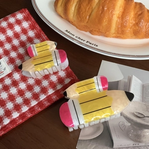 Cute acrylic pencil hair claw clips in vibrant yellow and pink colors for women