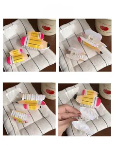 Detailed views of yellow pencil hair claw clips in two sizes with glossy finish