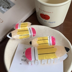 Set of two cute yellow acrylic pencil hair claws for ponytails and creative hairstyling