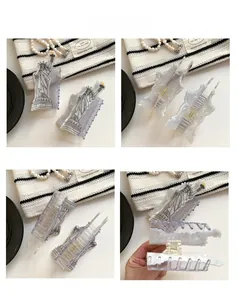 Detail view showing Liberty acetate hair claw clip with marble texture and spring mechanism
