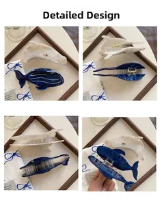 Detail view of acetate blue whale hair claw clip with marble texture and metal spring