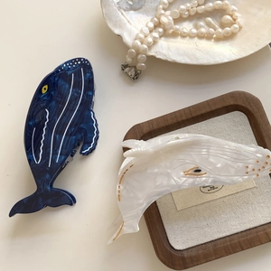 Blue and white whale acetate hair claws with marble texture on elegant props