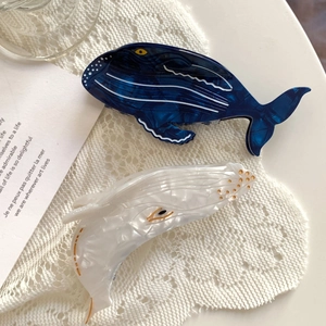 Blue and pearl white whale hair clips in high-quality acetate on lace background