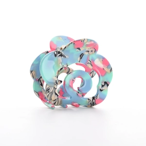 Abstract floral acetate hair claw clip with colorful marble pattern on white background