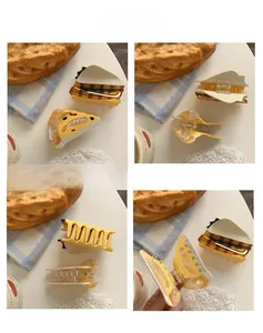 Close-up views of creative pizza and sandwich shaped acetate hair claws in high detail
