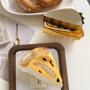 Creative sandwich and pizza acetate hair claws for women in a stylish tea set scene