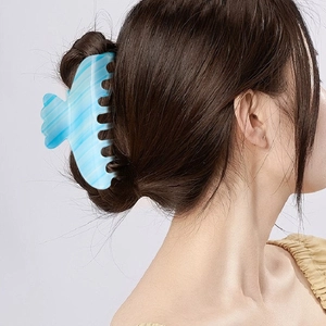 Light blue marble hair claw clip with water ripple texture for elegant updos
