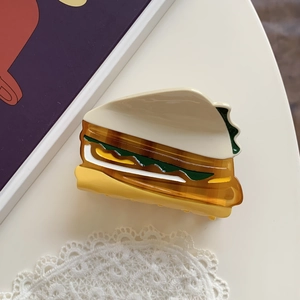 Detailed view of creative acetate sandwich hair claw clip with colorful layered textures