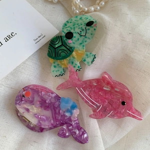 Acetate hair claw clip set featuring cute green turtle, pink dolphin, and purple whale shapes