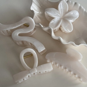 Elegant cream white marble hair claw clips set with flower and bow designs for women
