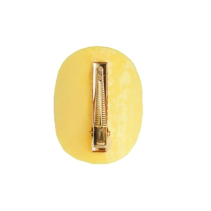 Creative potato chip hair clip for girls featuring yellow oval resin and golden metal duckbill