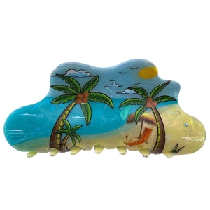 Large acetate hair claw clip with tropical beach palm tree design on white background