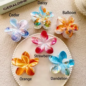 Floral print hair claw clips set with various botanical patterns in elegant tray display