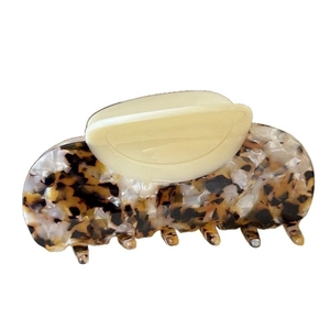 Leopard pattern acetate shark hair claw clip with cream beige top handle on white background