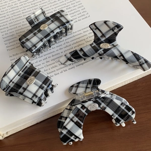 Classic black and white plaid hair claw clips set in four acetate geometric shapes