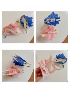 Detail shots of sturgeon-shaped acetate hair claws showing blue and pink textures