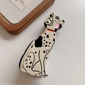 Detailed close-up of a spotted dalmatian dog hair claw clip made of acetate resin