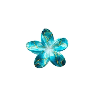 Elegant blue marble flower hair claw with artistic golden silk outlines on white background