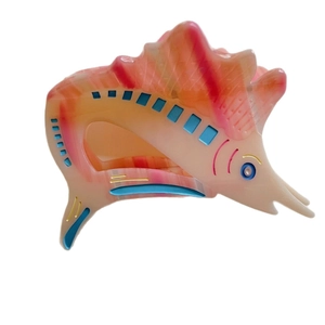 Elegant ocean fish acetate hair claw clip with pink marble texture and fin detail