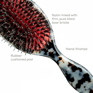 Hand-finished boar bristle hair brush with tortoiseshell handle and red cushion base