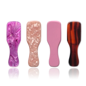 Mini acetate hair brushes with anti-static air cushions in four marble and tortoise patterns