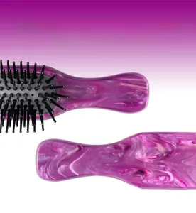 Detail of purple marble acetate hair comb with anti-static teeth and unique texture