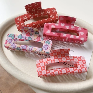 Set of large rectangular acrylic hair claws with various Valentine heart and rose patterns