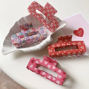 Set of four large rectangular heart-patterned acrylic hair claws for Valentine's Day