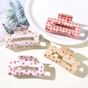 Set of four floral and cherry print rectangular hair claws in fresh colorful styles