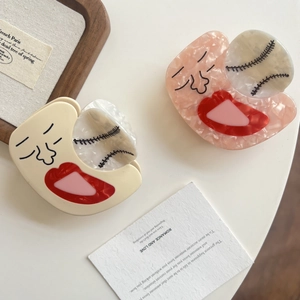 Abstract face acetate hair claws in creamy white and pink marble with baseball details
