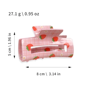 Pink checkered hair claw clip with strawberry and daisy prints measuring 8 cm in length