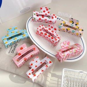 Cute fruit pattern hair claws in colorful strawberry and cherry designs for girls