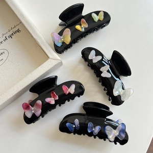 Black butterfly hair claw clips with gradient resin designs and rhinestone accents