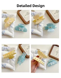 Detailed close-up showing the yellow and blue bow hair clips with crystal accents from multiple angles