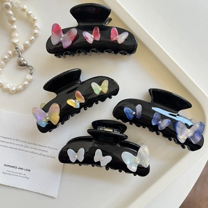 Elegant black acetate hair claws with colorful resin butterflies and rhinestones